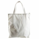 Fototapeta  - White canvas tote bag on a white backdrop