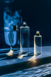Perfume bottles on black background with blue light and reflection.  Mock up.