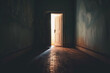 A dark hallway with a white door that is open. The light shining through the door creates a sense of hope and possibility