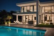 Illuminated white home showcase exterior and swimming pool at night