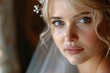 Up-close perspective of a blonde bride with piercing blue eyes, her delicate features adorned with soft makeup and a shimmering tiara, basking in the glow of her wedding day 01