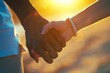 Extreme close-up of a diverse couple's intertwined hands, illuminated by sunlight, showcasing the complexities of divorce, yet hinting at the strength of their bond 01