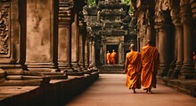 Monks In Orange Robes In A Hindu Temple.