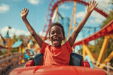 Fototapeta  - Joyful Young Boy Raising Hands on Roller Coaster Ride