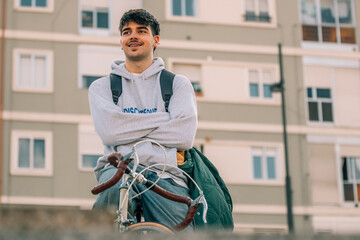 Poster - young man or student on the street riding the vintage bicycle