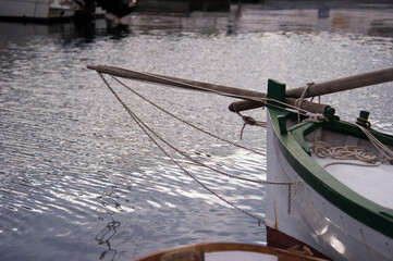 Wall Mural - old wooden and colourful fishing boats in the harbour. Satintino, Sardinia, Italy