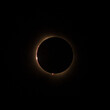 HD image of the solar eclipse in 2024 with the moon finally covering the sun. Baily's beads of light seen through canyons on the moon