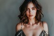 portrait of a beautiful women with medium length hair in a dress with a plunging neckline