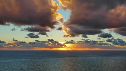 Wall Mural - Aerial view of sea surface during a beautiful colourful sunset, timelapse, 4k