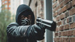 © Sean - A hooded individual holds a firearm in an urban brick alleyway, depicting concepts of crime and a cyber-era struggle for safety