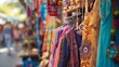 The soft focus captures the essence of a bohemian outdoor market with colorful vintage clothing and unique trinkets creating a whimsical background for shoppers browsing under the .