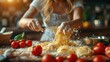 Woman preparing pasta on kitchen table, close up view