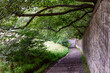 Foot path along a stone wall, Edinburgh, Scotland