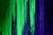© swoodie - flecks and strokes of fluorescent paint on canvas lit by blacklight