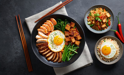 Wall Mural - Asian-inspired dining scene ,Set it on a dark wooden table in a restaurant, Include a plate of fried rice topped with a fried egg and slices of grilled meat