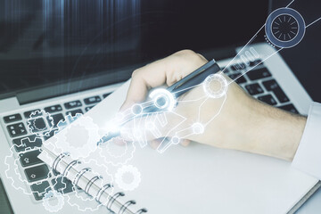Aufkleber - Creative abstract robotics technology sketch and hand writing in notepad on background with laptop, future technology and AI concept. Double exposure