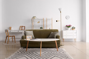 Wall Mural - Interior of living room with sofa, drawers and workplace