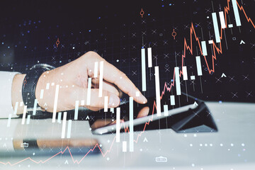Poster - Abstract creative financial graph with finger clicks on a digital tablet on background, financial and trading concept. Multiexposure