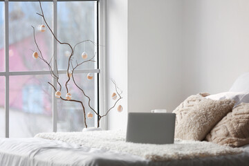 Poster - Vase with tree branches and Easter eggs near window in light bedroom