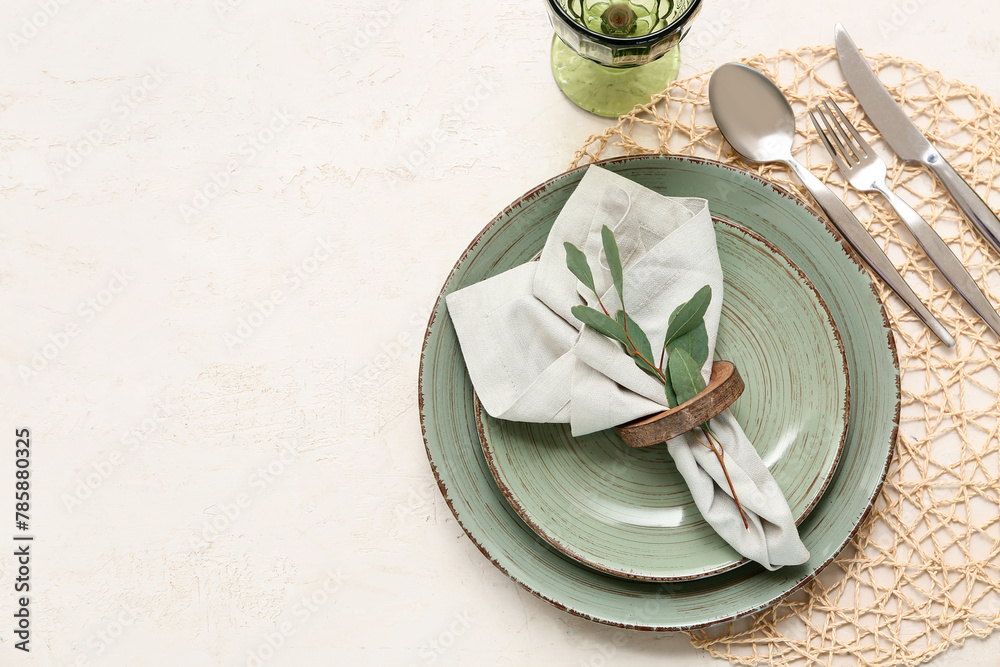 Beautiful table setting with leaves on white background