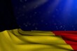 nice dark image of Belgium flag lying flat in corner on blue background with selective focus and empty place for your text - any occasion flag 3d illustration..