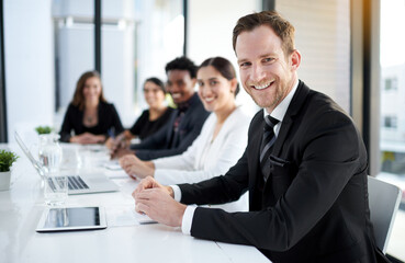 Poster - Meeting, portrait and happy man with business people in conference room with confidence, tech or plan. Boardroom, men and women in corporate workshop with laptop, report and smile at startup office