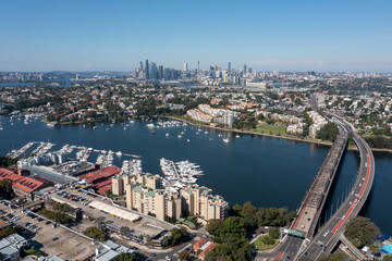 Canvas Print - Sydney suburb of Drummoyne, city skyline and Parramatta river and Iron cove bridge.