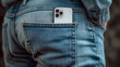 Mobile phone in back pocket jeans.