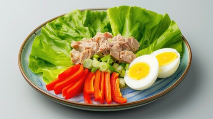 Wall Mural - Fresh Tuna Salad Plate with Boiled Eggs, Lettuce, and Carrots