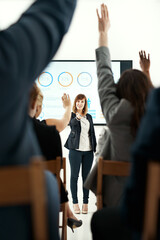 Poster - Businesswoman, presentation and hands up for questions in audience with graphs, review or market research. Female person, coworkers and back in meeting for group seminar, statistics or percentage