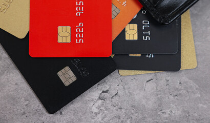 Canvas Print - Pile of different credit cards on grey table, top view