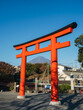 Traditional Japanese gate shrine entrance with Fuji mountain on background