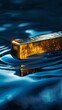 Captures the gold bar with reflections in a surface of cool blues, creating a serene and almost meditative visual experience