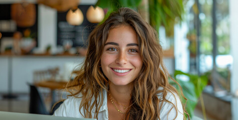 Sticker - A woman with long brown hair is smiling at the camera