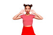 Portrait of young gorgeous and shocked girl with brown eyes and red lipstick on the mouse look at the camera with her fingers spread wide. Concept of advertising isolated on red background