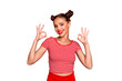 Close up portrait of happy, pretty, confident and smiling girl striped shirt showing ok sign standing on red background