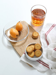 Wall Mural - A cup of coffee and cookies on a white table top