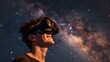 Smiling young man in virtual reality glasses against the background of the Milky Way galaxy.