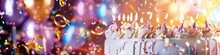 A Close-up Of A Beautifully Decorated Birthday Cake, Complete With Intricate Icing And Shimmering Candles, Set Against A Backdrop Of Swirling Confetti And Sparkling Balloons.