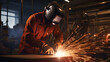 man welds at the factory