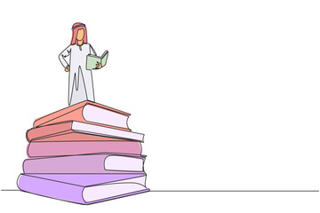 Poster - Single continuous line drawing Arab man standing on pile of books reading fiction story book. Intrigued by book series. Read anywhere to finish reading. Reading. One line design vector illustration