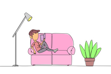 Wall Mural - Continuous one line drawing boy sitting stretched out on the sofa reading a book. Really like the content of the book reading on each page. Impressive. Single line draw design vector illustration