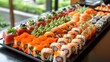 Various types of sushi, including California roll, on the tray at the buffet