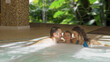 © MEDIAIMAG - Happy family enjoy relaxation in the hot tub pool at the spa