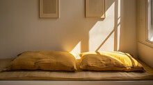 Yellow Brown Pillows Against Wall With Two Poster Frames. High Quality Photo