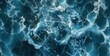Intricate Foam Patterns Adorn Deep Blue Ocean Waves