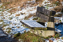 Wooden Bench Covered With Snow