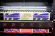 © Itsanan - Sublimation printer printing T shirt show in Garment and Textile Manufacturing Industry.