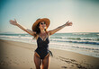 Woman with open arms on a sandy beach - elation as the waves meet the shore, her straw hat and elegant swimsuit symbolizing the quintessential summer joy.