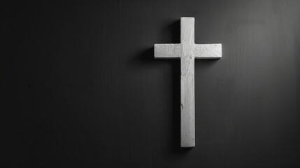 Wall Mural - Black and white image of a lone cross on the wall. Good Friday holiday, minimalist, copy space.